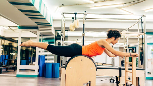 Elevate Your Pilates Routine with Chairs and Ladder Barrels